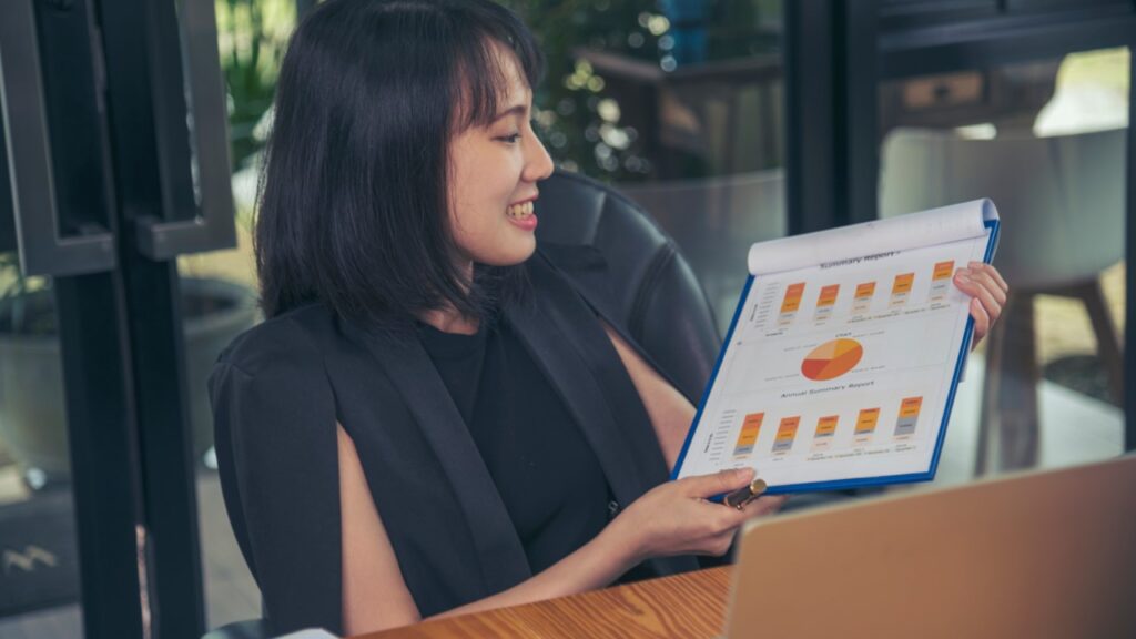 Woman holding printed graphics